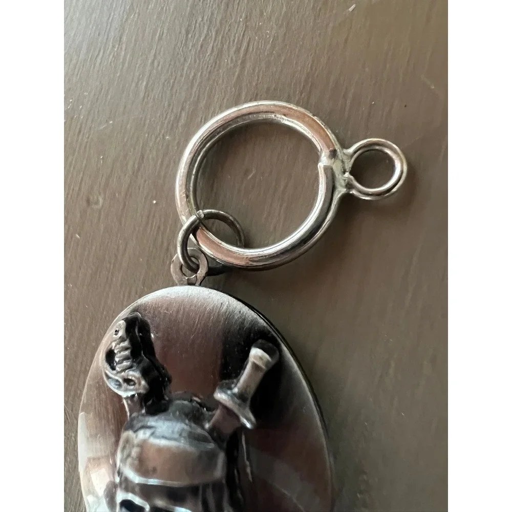 Disney Pirates of the Caribbean Locket Keychain Jack Sparrow Skull Silver Tone